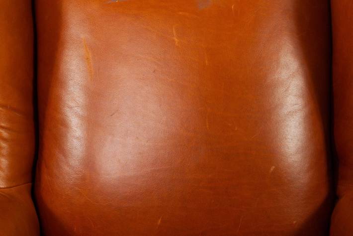 Poltrona inglese bergere in cuoio cognac vintage